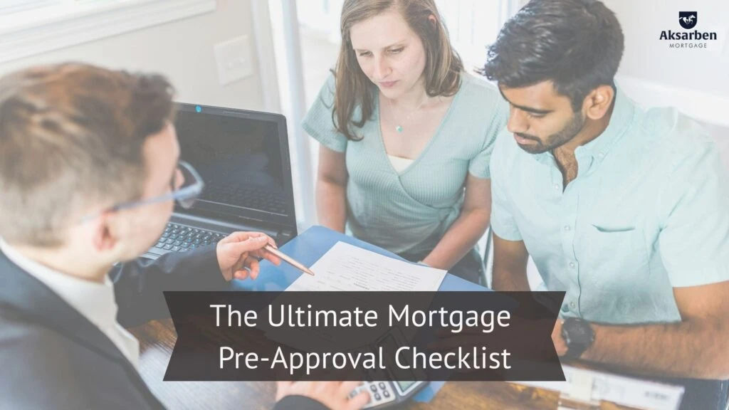 Couple reviewing mortgage documents with a loan officer during a pre-approval meeting.